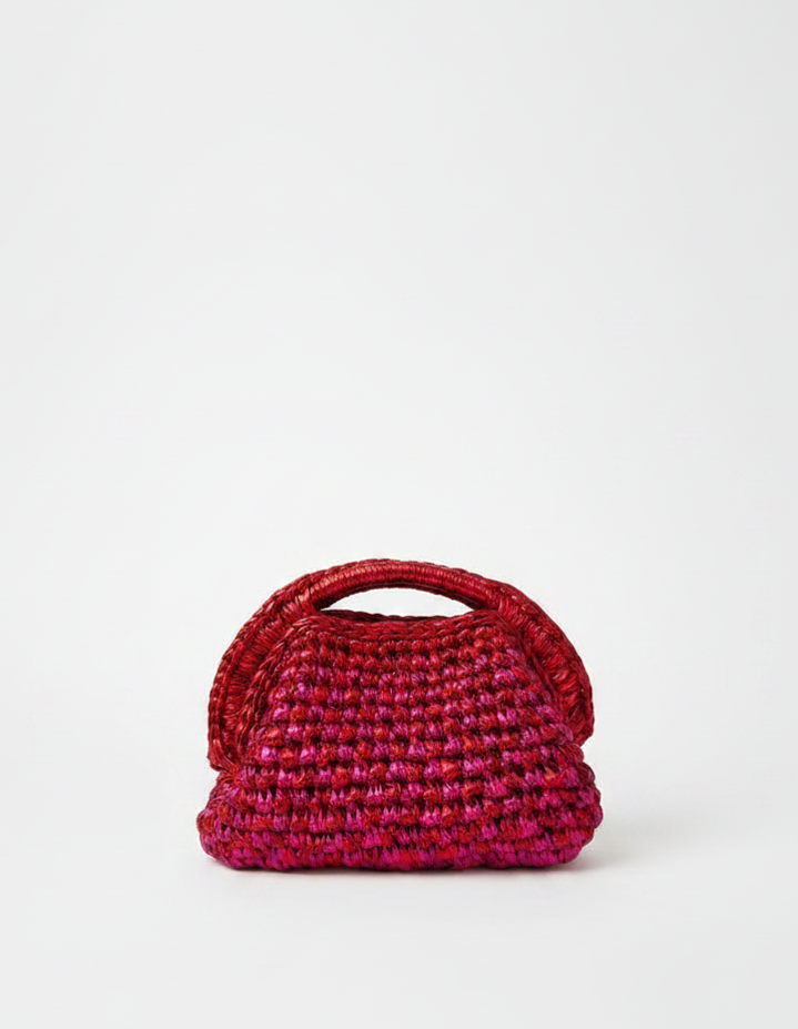 Red woven handbag on a white background