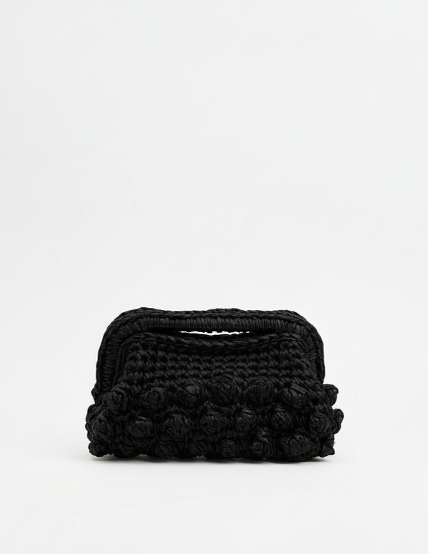 Black textured clutch bag on a white background