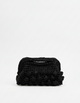 Black textured clutch bag on a white background