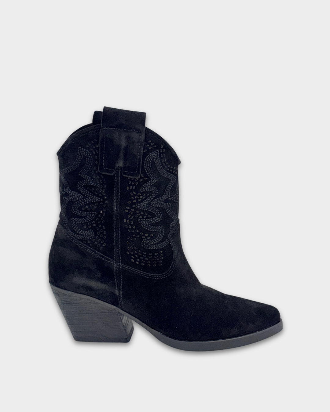 Black cowboy boot on a light gray background