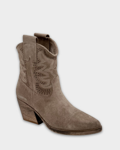 Taupe ankle boot with cut-out design on a light gray background
