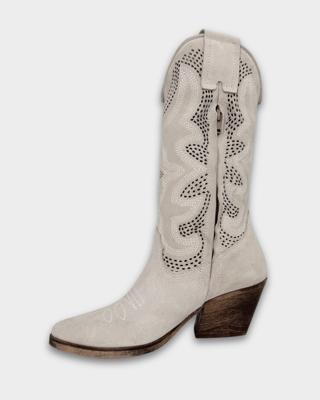 White cowboy boot with brown heel on a white background